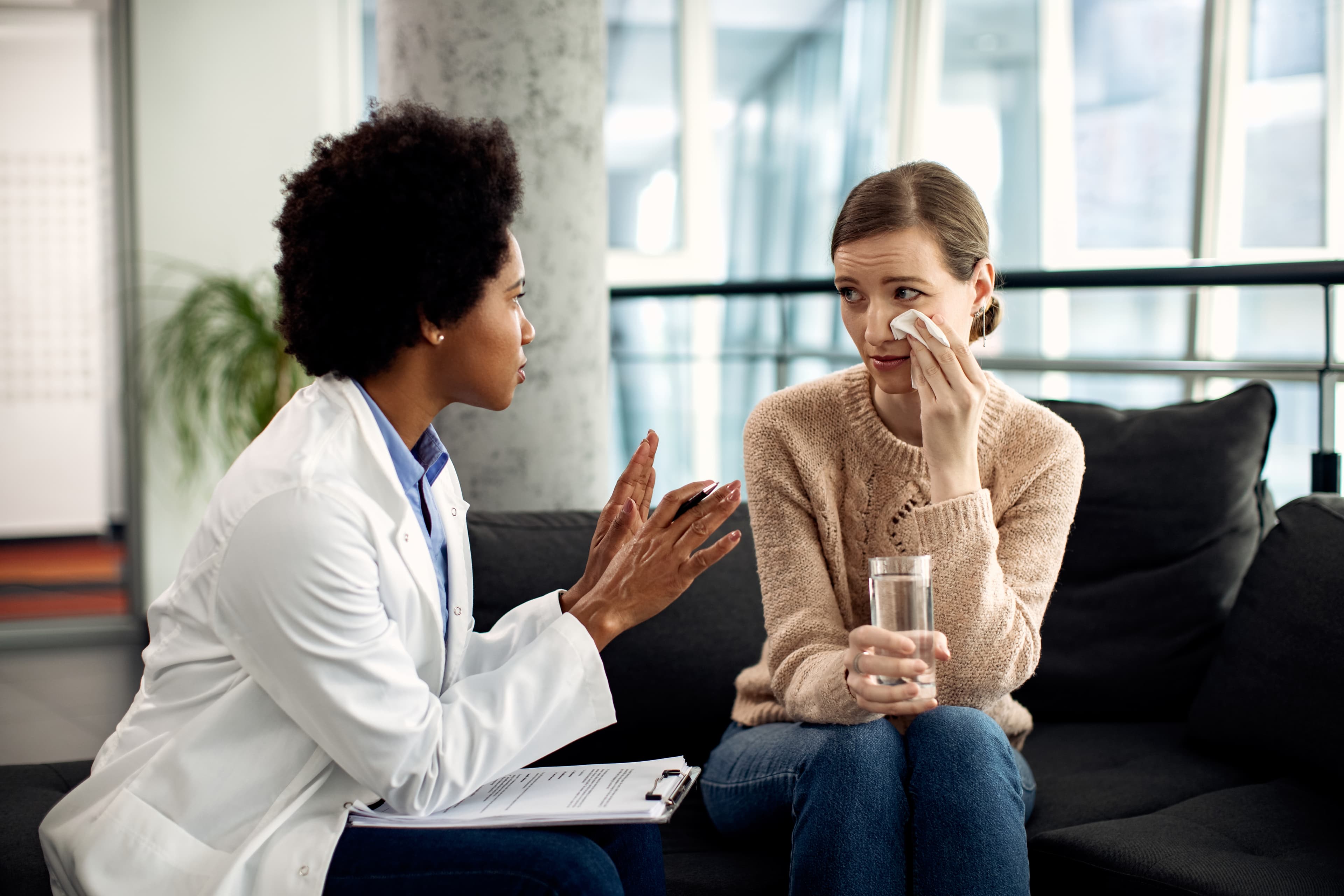 Therapist speaking with a patient